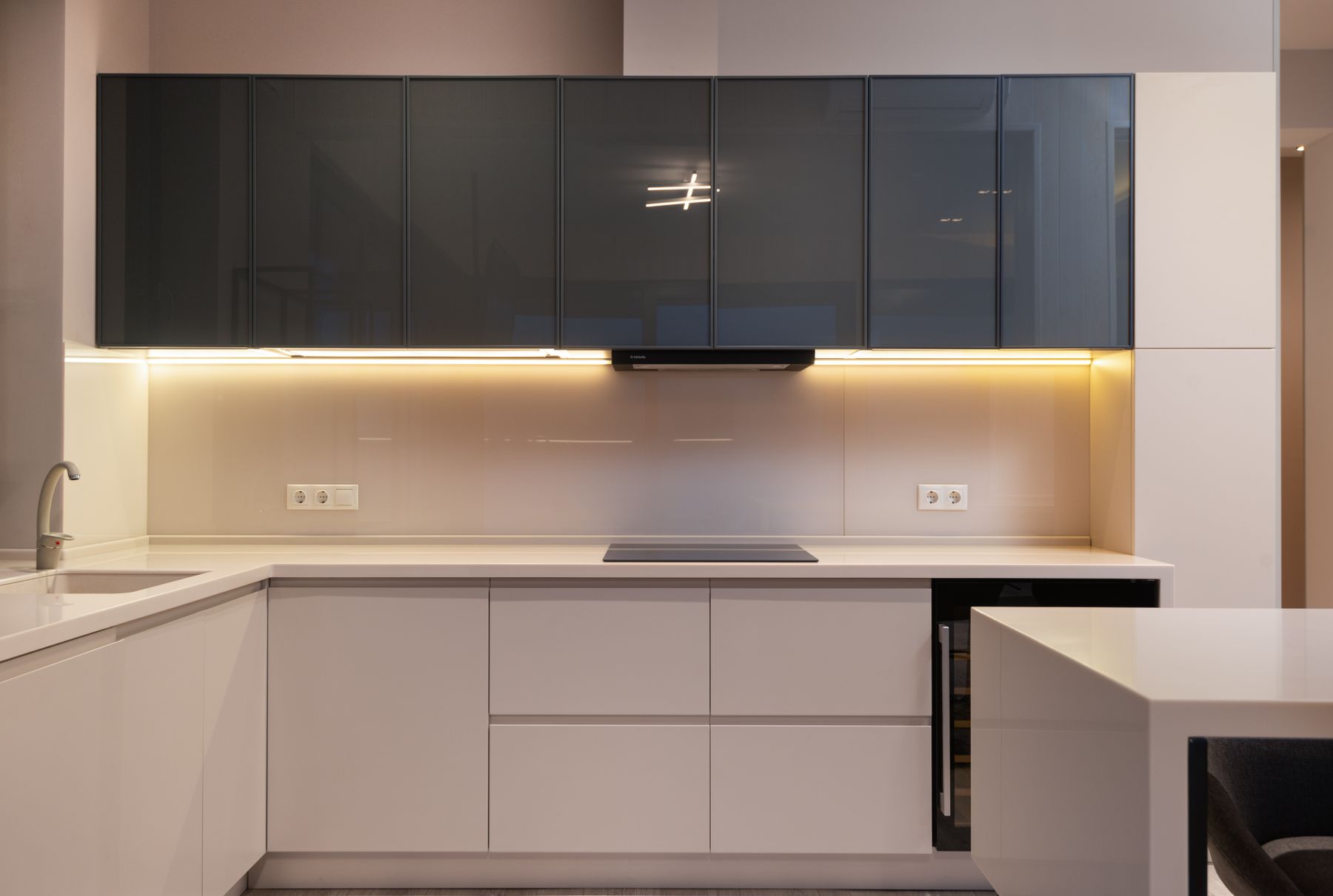 A modern renovated kitchen with new cabinetry and stone countertops