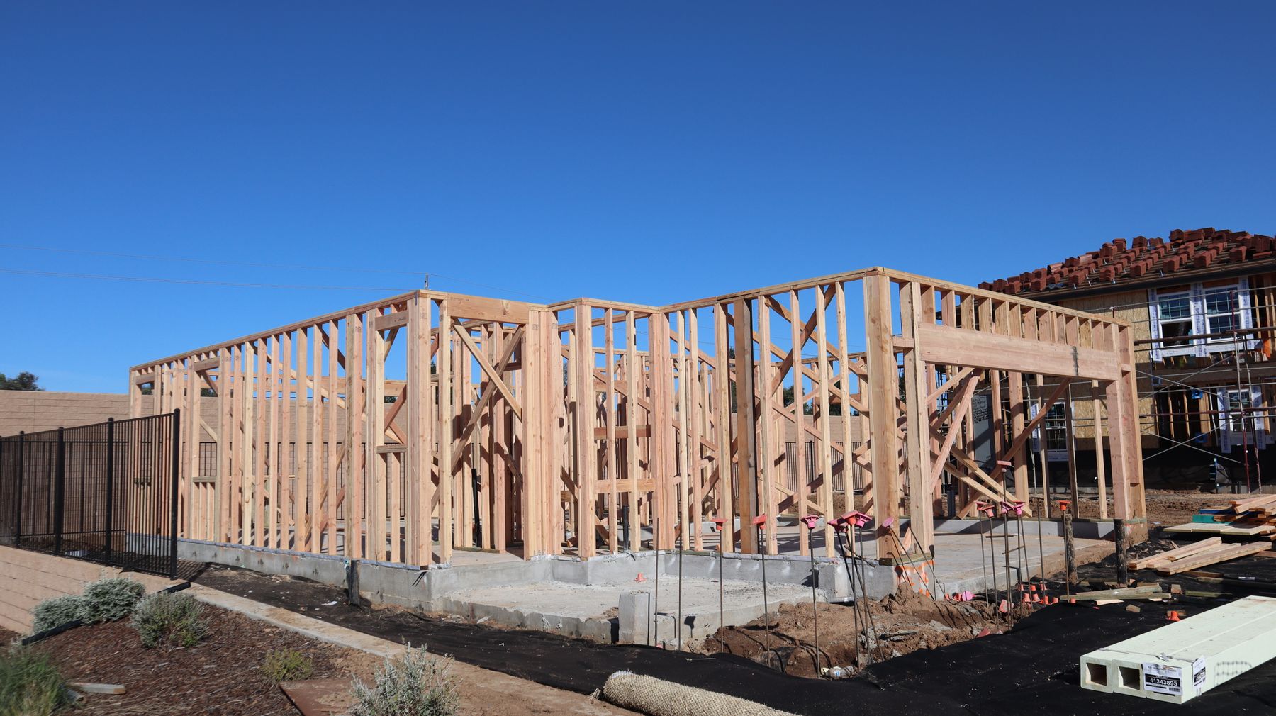 A new residential home under construction with its timber frame exposed